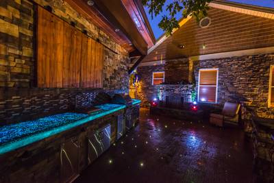 Crystal Waters main level outdoor patio lounge with glowing concrete countertops