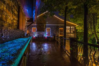 Crystal Waters main level outdoor kitchen with ambient lighting