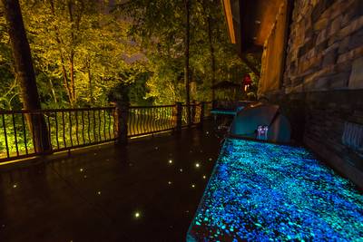 Crystal Waters main level outdoor patio with ambient lighting