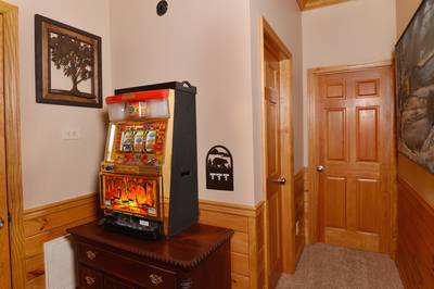 Crystal Waters lower level game room with token slot machine