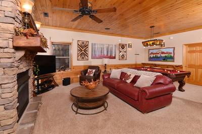Crystal Waters lower level game room with sleeper sofa