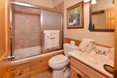 Crystal Waters lower level bathroom two with jetted tub/shower combo