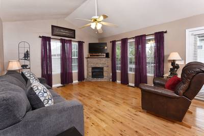Rocky Top Chalet living room with sleeper sofa, recliner, and gas fireplace
