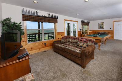 Getaway Mountain Lodge lower level game room with sleeper sofa