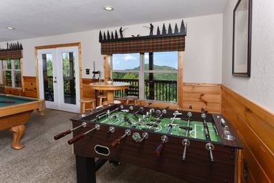 Getaway Mountain Lodge lower level game room with foosball table