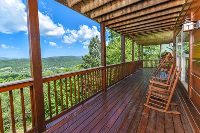 Getaway Mountain Lodge lower level covered wraparound deck with Rocking Chairs
