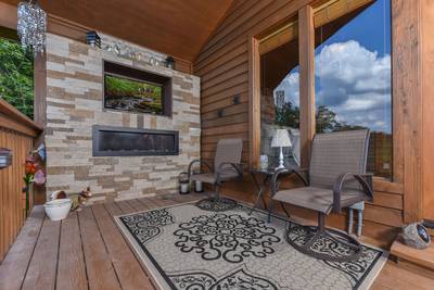 Cabin Fever covered back deck with sitting area