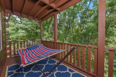 Antler Run covered deck with hammock