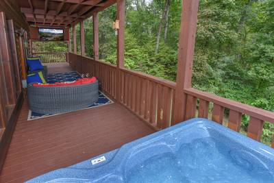 Antler Run covered wrap around deck with hot tub