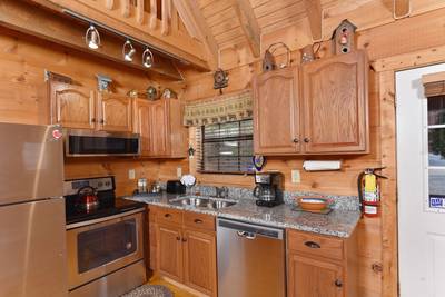 Beary Beary Special fully furnished kitchen with stainless steel appliances and granite countertops