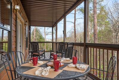 Best Time Ever covered back deck with table and chairs