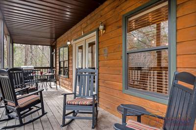 Best Time Ever covered back deck with rocking chairs