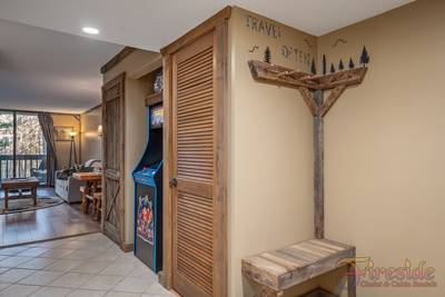 Rustic River entry way and stand up arcade machine
