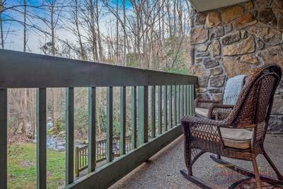 Rustic River back patio with rocking chairs