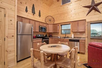 Lighthouse Harbor dining area and fully furnished kitchen
