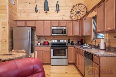 Lighthouse Harbor fully furnished kitchen with stainless steel appliances
