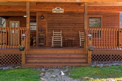 Bear Run covered entry deck with rocking chairs