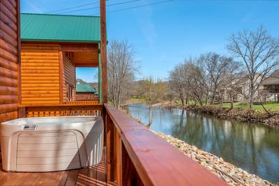 Lighthouse Harbor hot tub overlooking the Little Pigeon River