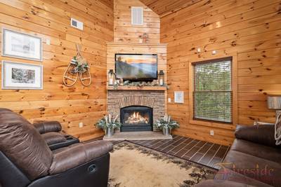 Winter Ridge living room with stone encased fireplace