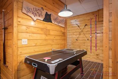 Winter Ridge lower level game room with air hockey table