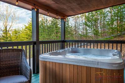 Winter Ridge covered entry deck with hot tub