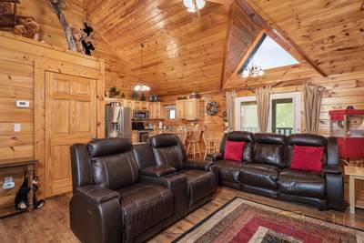 Three Bears main level living room with love seat with 2 recliners