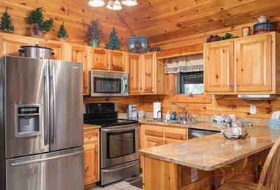 Three Bears main level fully furnished kitchen with stainless steel appliances and granite countertops