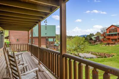 Three Bears lower level covered back deck with rocking chairs