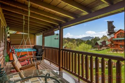 Three Bears main level covered back deck with swings