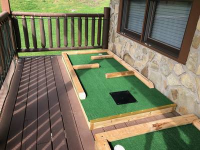 Three Bears lower level covered back deck putt putt course