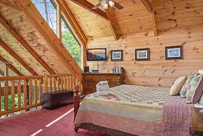 A Walk in the Clouds main level loft bedroom with 32-inch flat screen TV