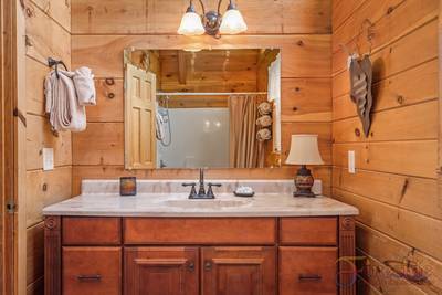 A Walk in the Clouds main level full bathroom with tub/shower combo