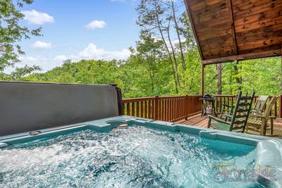 A Walk in the Clouds lower level covered back deck view from hot tub