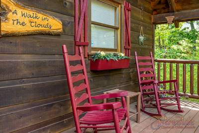 A Walk in the Clouds covered entry deck with rocking chairs