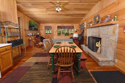 Walden Ridge Retreat dining area and wood burning fireplace