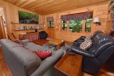 Walden Ridge Retreat living room with 65-inch flat screen TV