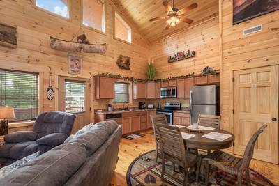 River Haven dining area and fully furnished kitchen with stainless steel appliances