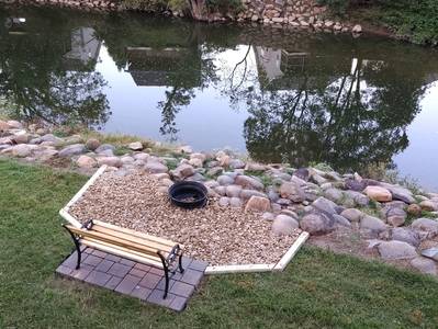 River Haven outdoor fire pit next to the Little Pigeon River