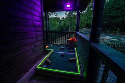 Best Time Ever glow in the dark putt putt course on covered deck
