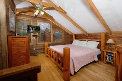 Country Charm upper level bedroom with king size bed