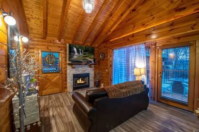 Dancing Waters living room with seasonal gas fireplace