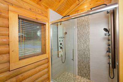 Dancing Waters bathroom with spa shower with double shower heads