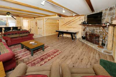 Under Ober living room with seasonal wood burning fireplace