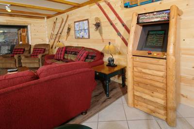 Under Ober living room with stand up arcade machine