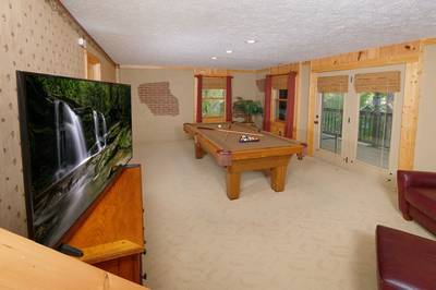 Adele's Retreat lower level game room with 55-inch TV