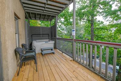 Adele's Retreat lower level covered deck with hot tub