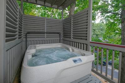 Adele's Retreat lower level covered deck with hot tub