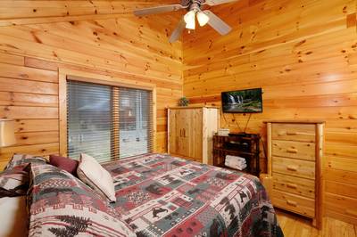 Down by the River bedroom one with 24-inch flat screen TV
