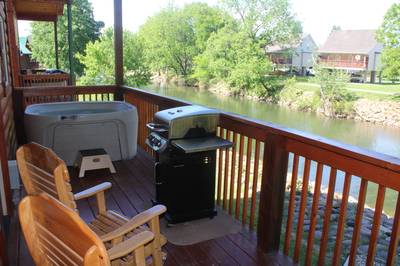 Lighthouse Harbor covered back deck with hot tub and grill