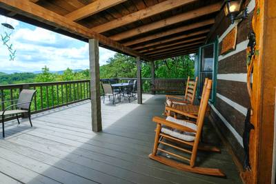 Secluded Summit covered front deck with rocking chairs